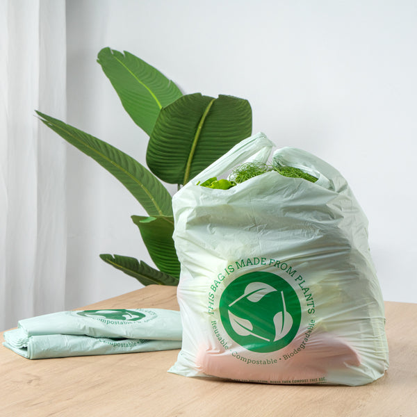 Restaurantware Basic Nature Green Plastic T-Shirt Bag - 1/6 Size Compostable - 12" X 6 1/2" X 22" - 500 Count Box