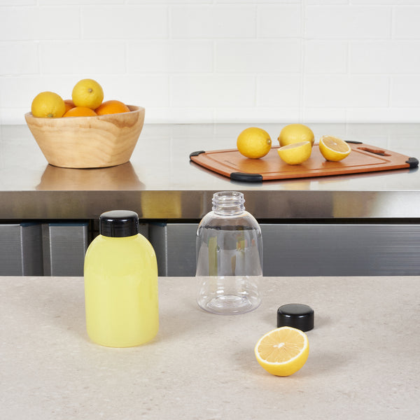 Restaurantware Bottle Tek 17 Oz Round Clear PET Juice Bottle - With Cap - 3" X 3" X 5 1/2" - 100 Count Box