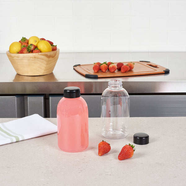 Restaurantware Bottle Tek 20 Oz Round Clear PET Juice Bottle - With Cap - 3 " X 3" X 6 1/4" - 100 Count Box"