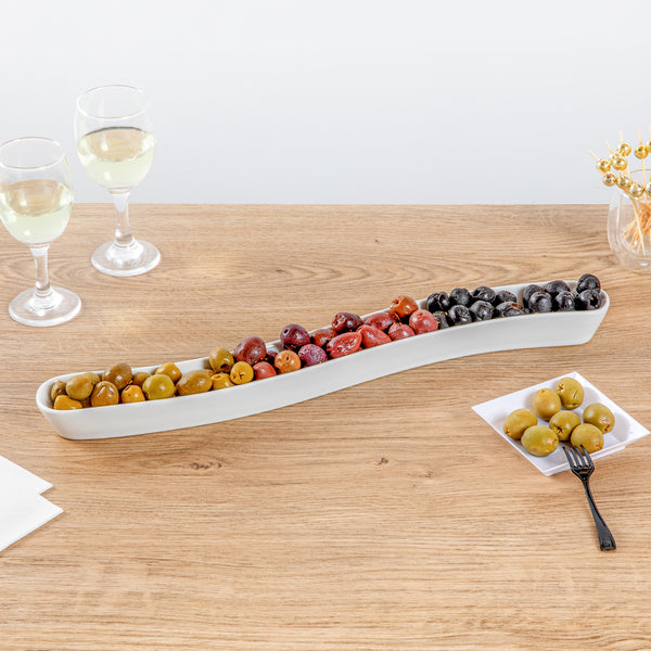 Restaurantware Chef 101 Swerve 14 Oz Curved White Porcelain Olive Plate - 17" X 2 1/2" X 1 1/4" - 1 Count Box