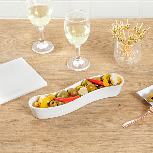 Restaurantware Chef 101 Swerve 6 Oz Curved White Porcelain Olive Plate - 8 3/4" X 2 1/4" X 1 1/2" - 1 Count Box