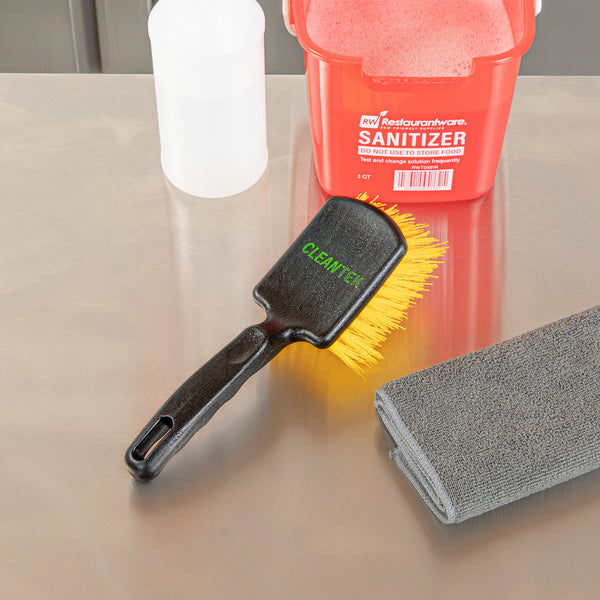 Restaurantware Clean Tek Professional 10 1/4" Black Plastic Utility Scrub Brush - With Yellow Bristles - 1 Count Box