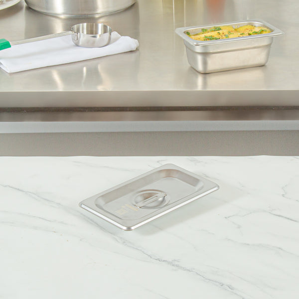 Restaurantware Kitchen Tek Stainless Steel Lid - Fits 1/9 Size Steam Table Pan - 12 Count Box