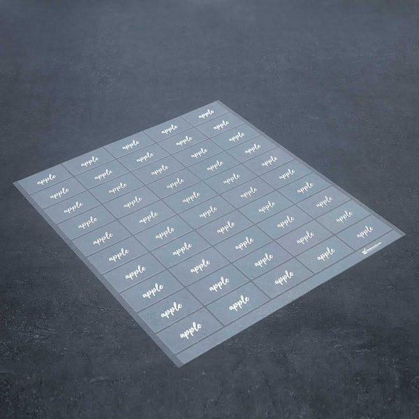 Restaurantware Label Tek Plastic Apple Label - Clear With White Font Water-Resistant - 2" X 1" - 100 Count Box