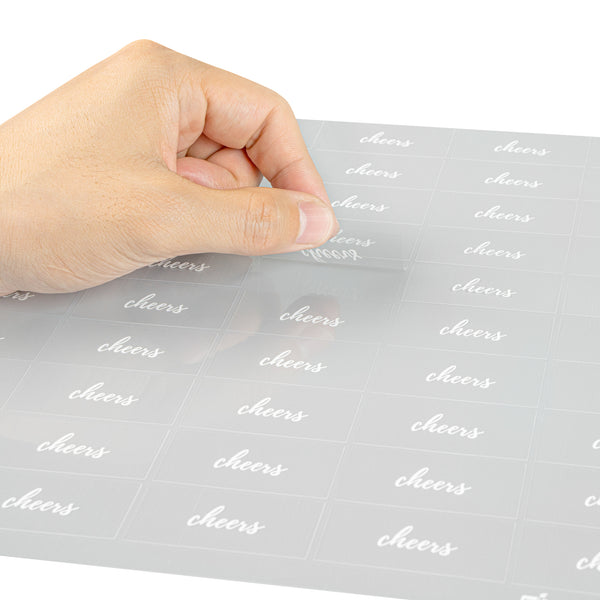 Restaurantware Label Tek Plastic Cheers Label - Clear With White Font Water-Resistant - 2" X 1" - 100 Count Box