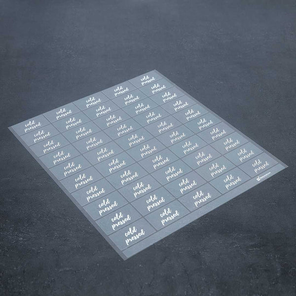 Restaurantware Label Tek Plastic Cold Pressed Label - Clear With White Font Water-Resistant - 2" X 1" - 100 Count Box