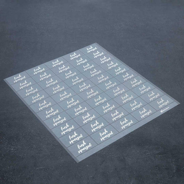 Restaurantware Label Tek Plastic Fresh Squeezed Label - Clear With White Font Water-Resistant - 2" X 1" - 100 Count Box