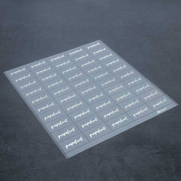 Restaurantware Label Tek Plastic Grapefruit Label - Clear With White Font Water-Resistant - 2" X 1" - 100 Count Box