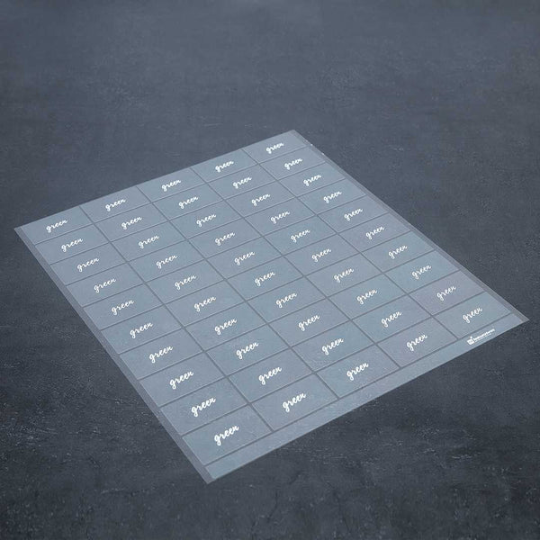 Restaurantware Label Tek Plastic Green Label - Clear With White Font Water-Resistant - 2" X 1" - 100 Count Box