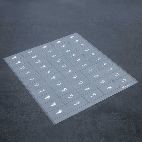 Restaurantware Label Tek Plastic Milk Label - Clear With White Font Water-Resistant - 2" X 1" - 100 Count Box