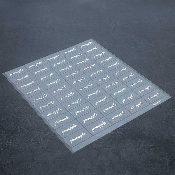 Restaurantware Label Tek Plastic Pineapple Label - Clear With White Font Water-Resistant - 2" X 1" - 100 Count Box