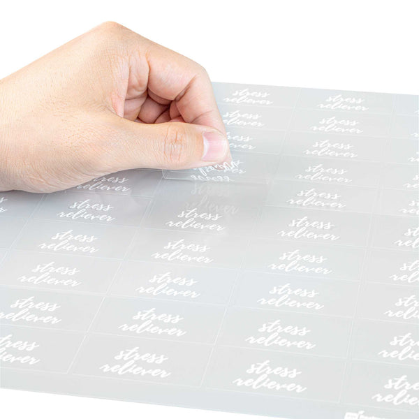 Restaurantware Label Tek Plastic Stress Reliever Label - Clear With White Font Water-Resistant - 2" X 1" - 100 Count Box