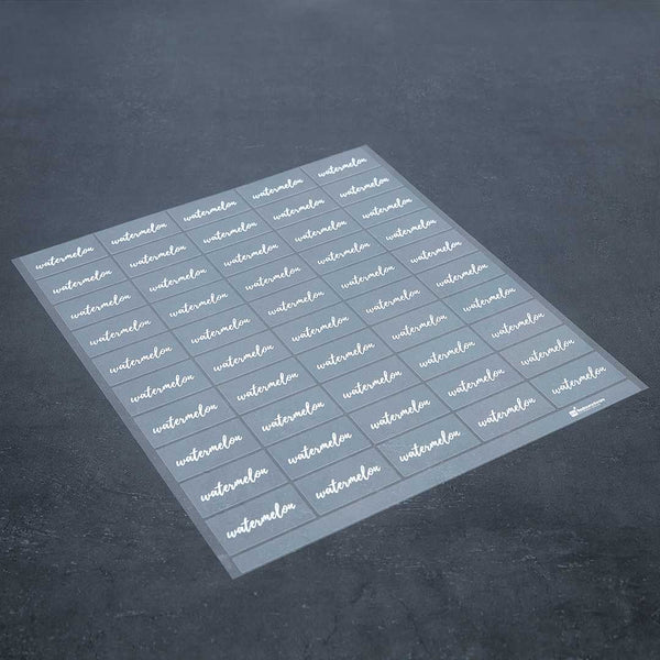 Restaurantware Label Tek Plastic Watermelon Label - Clear With White Font Water-Resistant - 2" X 1" - 100 Count Box