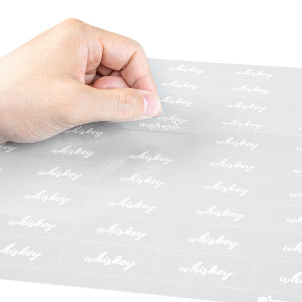 Restaurantware Label Tek Plastic Whiskey Label - Clear With White Font Water-Resistant - 2" X 1" - 100 Count Box