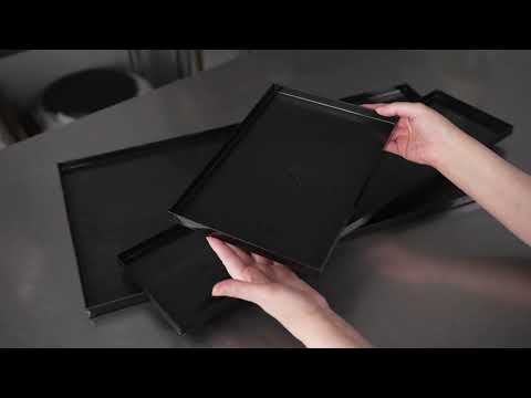 Restaurantware Maxi Serve Rectangle Black Plastic Medium Tray - Faux Wood Grain - 23 1/2" X 6" - 25 Count Box