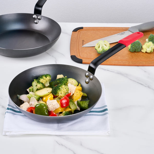 Restaurantware Met Lux 1 Black Carbon Steel 10" Pre-Seasoned Fry Pan And 1 Red Silicone Pan Handle Sleeve
