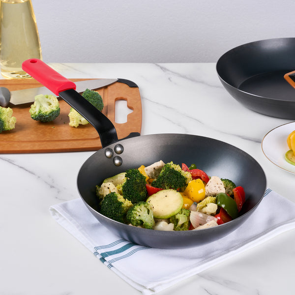 Restaurantware Met Lux 1 Black Carbon Steel 10" Pre-Seasoned Fry Pan And 1 Red Silicone Pan Handle Sleeve