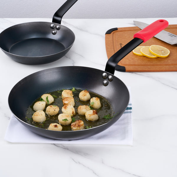 Restaurantware Met Lux 1 Black Carbon Steel 11" Pre-Seasoned Fry Pan And 1 Red Silicone Pan Handle Sleeve