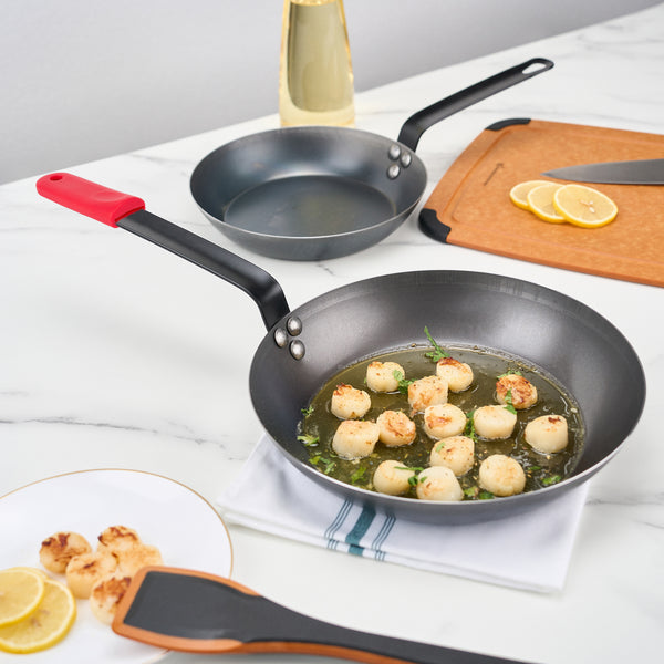 Restaurantware Met Lux 1 Black Carbon Steel 11" Pre-Seasoned Fry Pan And 1 Red Silicone Pan Handle Sleeve