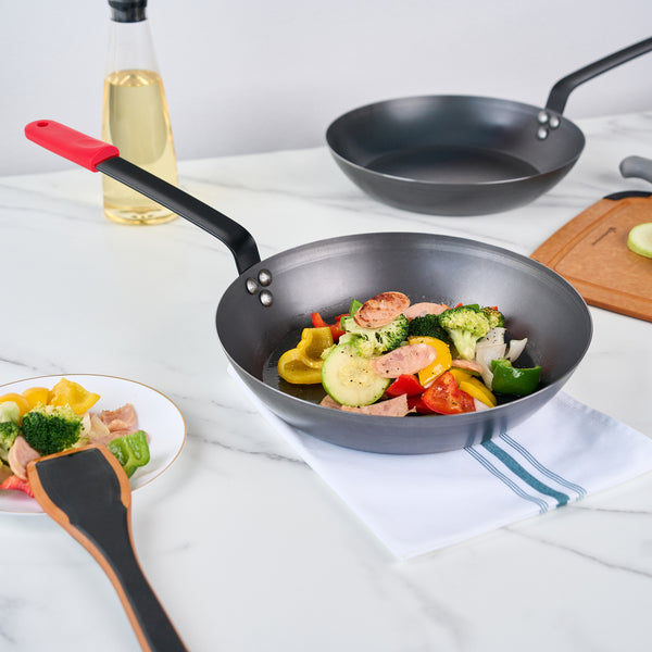 Restaurantware Met Lux 1 Black Carbon Steel 12" Pre-Seasoned Fry Pan And 1 Red Silicone Pan Handle Sleeve