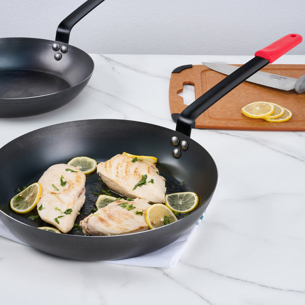Restaurantware Met Lux 1 Black Carbon Steel 13" Pre-Seasoned Fry Pan And 1 Red Silicone Pan Handle Sleeve