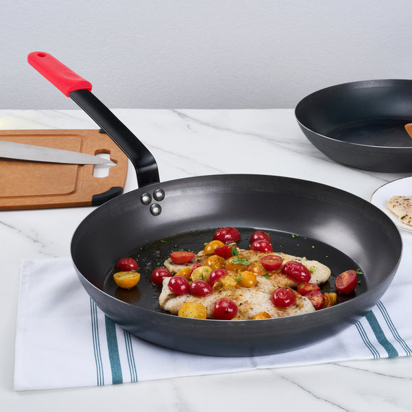 Restaurantware Met Lux 1 Black Carbon Steel 14" Pre-Seasoned Fry Pan And 1 Red Silicone Pan Handle Sleeve