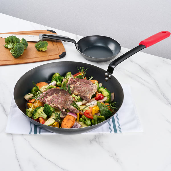 Restaurantware Met Lux 1 Black Carbon Steel 16" Pre-Seasoned Fry Pan And 1 Red Silicone Pan Handle Sleeve