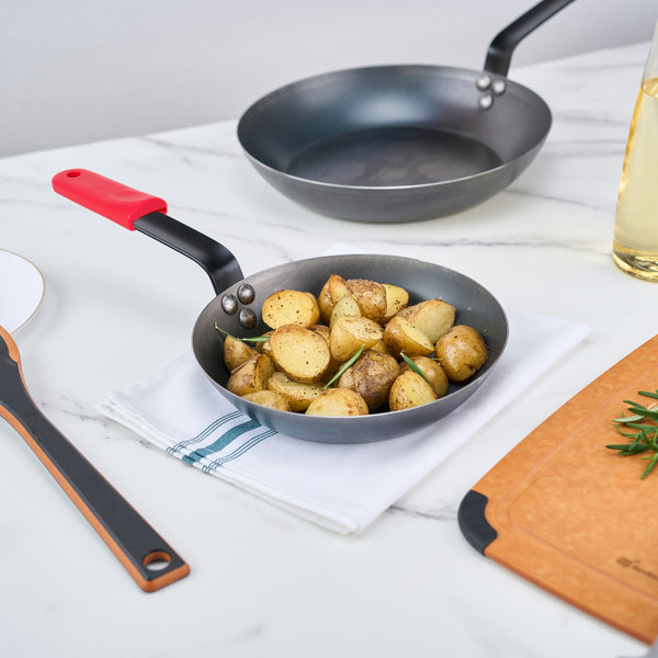 Restaurantware Met Lux 1 Black Carbon Steel 9" Pre-Seasoned Fry Pan And 1 Red Silicone Pan Handle Sleeve