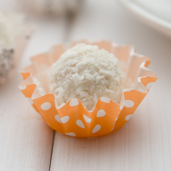 Restaurantware Panificio 0.4 Oz Round Polka-Dotted Hot Orange Paper Mini Baking Cup - Flared - 2" X 2" X 1/2" - 200 Count Box