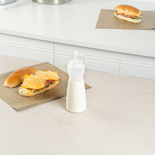 Restaurantware Sauce Tek 12 Oz Clear Plastic Squeeze Bottle - With Cap - 2 1/4" X 2 1/4" X 7 3/4" - 1 Count Box