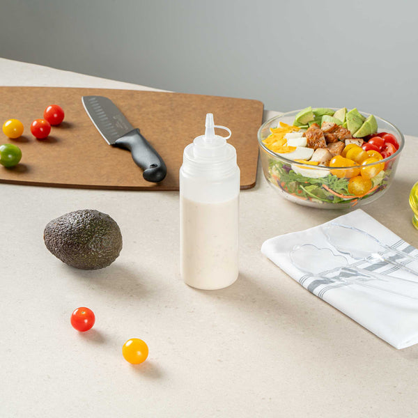 Restaurantware Sauce Tek 16 Oz Clear Plastic Squeeze Bottle - With Cap Wide Mouth - 2 1/2" X 2 1/2" X 7 3/4" - 1 Count Box