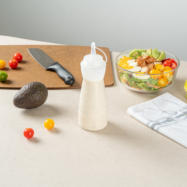 Restaurantware Sauce Tek 16 Oz Clear Plastic Squeeze Bottle - With Cap - 2 3/4" X 2 3/4" X 7 3/4" - 1 Count Box