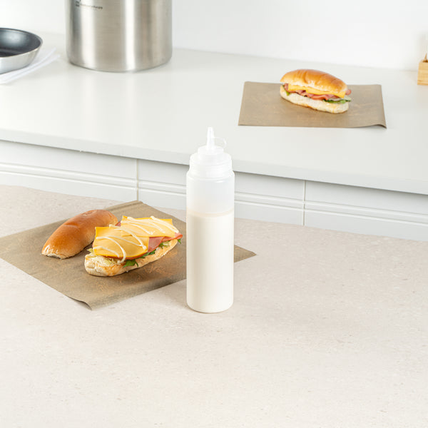 Restaurantware Sauce Tek 24 Oz Clear Plastic Squeeze Bottle - With Cap Wide Mouth - 2 1/2" X 2 1/2" X 10 1/4" - 1 Count Box