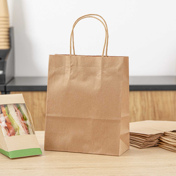 Restaurantware Saving Nature Kraft Paper Retail Bag - With Handles - 7" X 3 1/4" X 8 1/2" - 100 Count Box