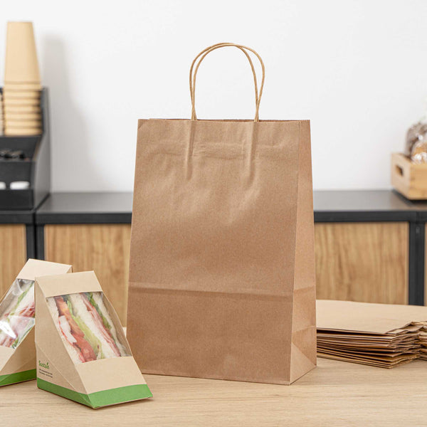 Restaurantware Saving Nature Kraft Paper Retail Bag - With Handles - 7 3/4" X 4" X 11 1/2" - 100 Count Box