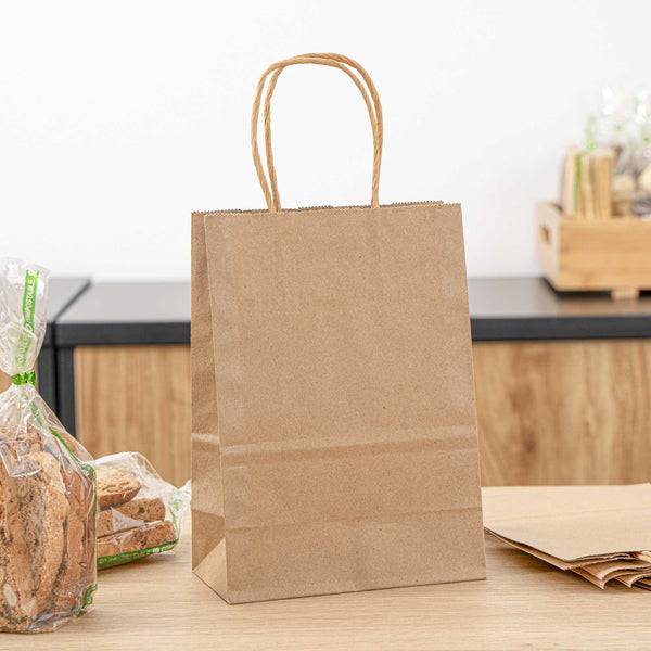 Restaurantware Saving Nature Kraft Paper Small Retail Bag - With Handles - 6" X 3 1/4" X 8 1/4" - 100 Count Box
