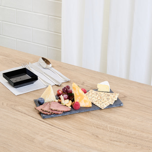 Restaurantware Stone Tek Rectangle Black Slate Serving Plate - 9 3/4" X 4 3/4" - 4 Count Box