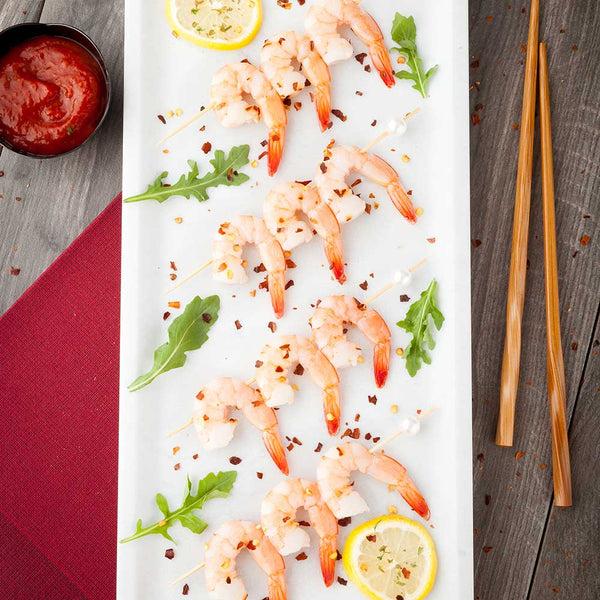 Restaurantware Stone Tek Rectangle White Marble Large Serving Plate - Italian - 13 3/4" X 6 1/2" X 3/4" - 1 Count Box