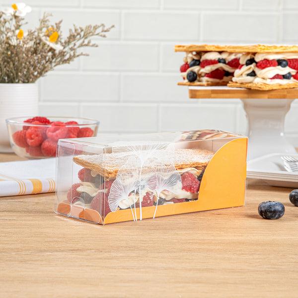 Restaurantware Sweet Vision Rectangle Clear Plastic Eclair Box - Orange Paper Sleeve Leaf Accent - 7" X 2 1/2" X 2 1/2" - 100 Count Box