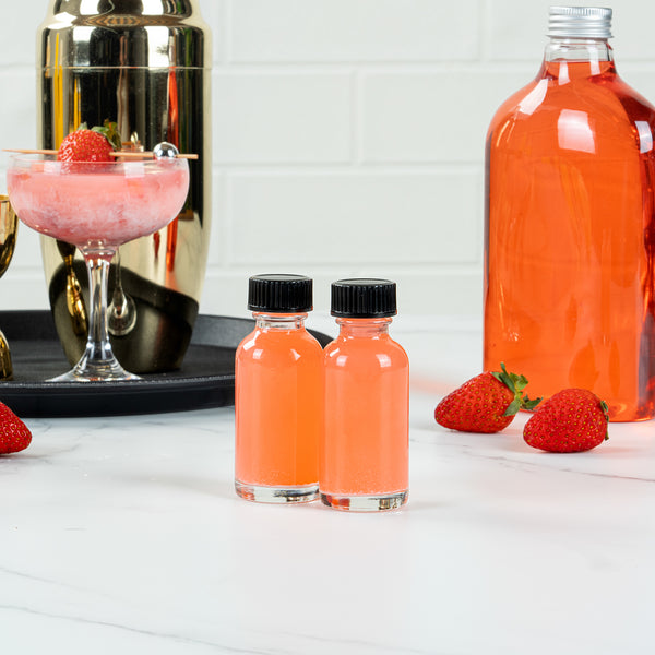 Restaurantware Vetri 1 Oz Boston Round Clear Glass Bottle - With Black Phenolic Cap - 1 1/4" X 1 1/4" X 3" - 48 Count Box