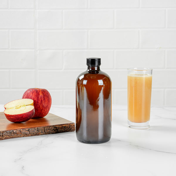 Restaurantware Vetri 16 Oz Boston Round Amber Glass Bottle - With Black Phenolic Cap - 3" X 3" X 6 3/4" - 12 Count Box