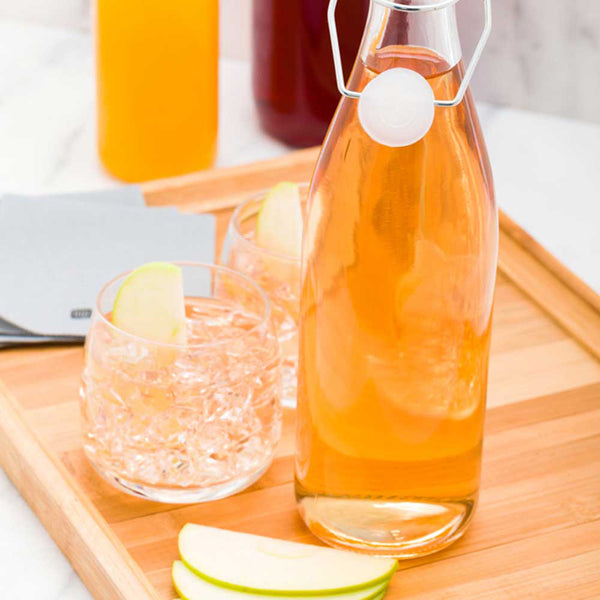 Restaurantware Vetri 17 Oz Round Glass Nostalgic Bottle - Swing Top - 2 3/4" X 2 3/4" X 10 3/4" - 10 Count Box