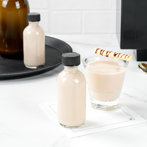 Restaurantware Vetri 2 Oz Boston Round Clear Glass Bottle - With Black Phenolic Cap - 1 1/2" X 1 1/2" X 3 3/4" - 48 Count Box