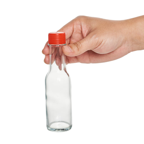 Restaurantware Vetri 3 Oz Glass Woozy Bottle - With Red Cap - 1 1/2" X 1 1/2" X 6" - 10 Count Box