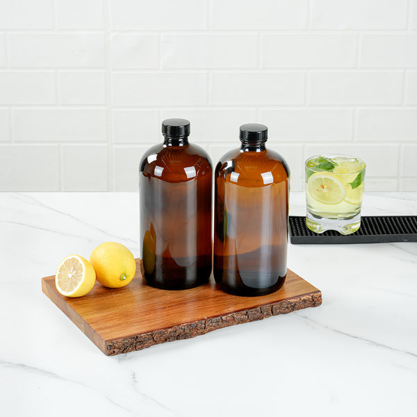Restaurantware Vetri 32 Oz Boston Round Amber Glass Bottle - With Black Phenolic Cap - 3 3/4" X 3 3/4" X 8" - 12 Count Box