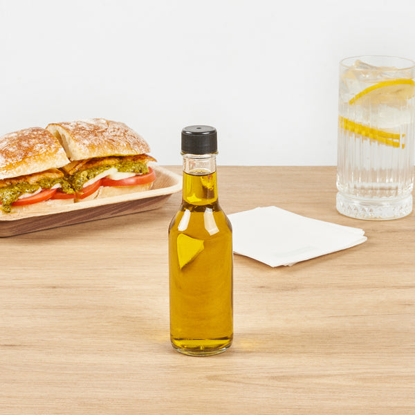 Restaurantware Vetri 5 Oz Glass Woozy Bottle - With Black Cap - 1 3/4" X 1 3/4" X 6 3/4" - 10 Count Box