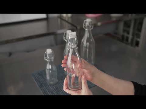 Restaurantware Vetri 9 Oz Round Glass Nostalgic Bottle - Swing Top - 2 1/4" X 2 1/4" X 7 3/4" - 10 Count Box