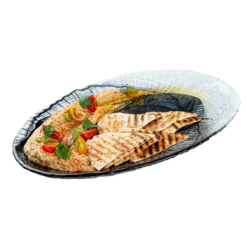 restaurantware Vetri Oval Black Glass Focus Serving Plate - 15" x 9 3/4" x 1 1/4" - 6 count box