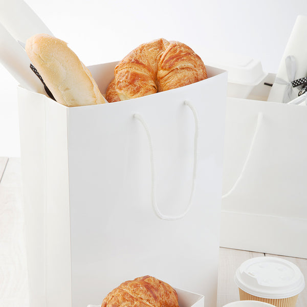Restaurantware Vogue Rectangle White Paper Large Shopping And Take Out Bag - Glossy Rope Handles - 9 1/2" X 4" X 14" - 10 Count Box