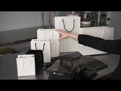 Restaurantware Vogue Rectangle White Paper Medium Shopping And Take Out Bag - Glossy Rope Handles - 8" X 4" X 10" - 10 Count Box